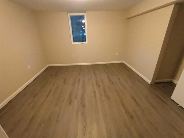 spare room with wood-type flooring