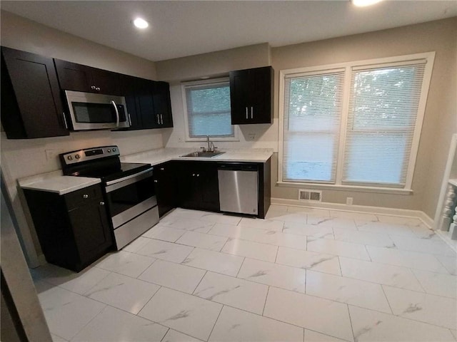 kitchen featuring appliances with stainless steel finishes and sink