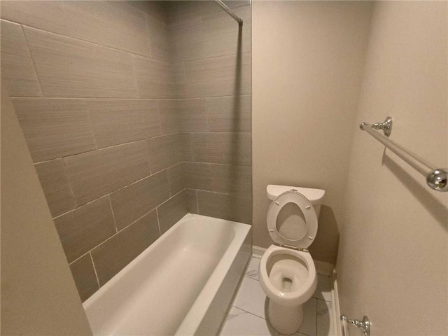 bathroom featuring toilet, plus walk in shower, and tile patterned floors