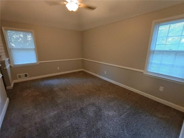 carpeted empty room featuring ceiling fan