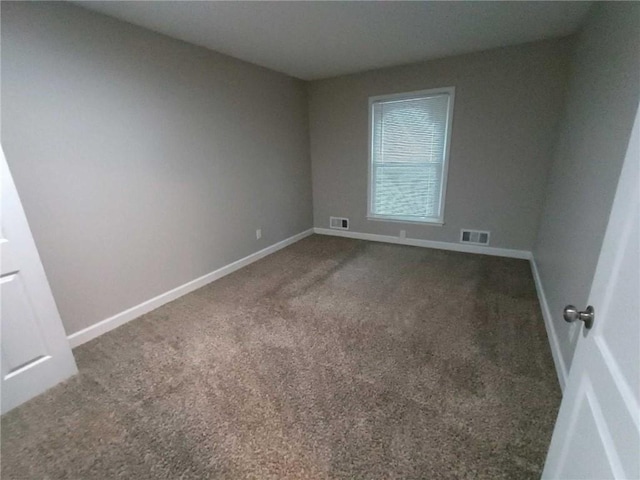 empty room with carpet flooring