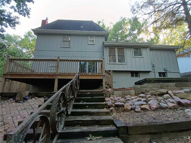 back of house featuring a deck