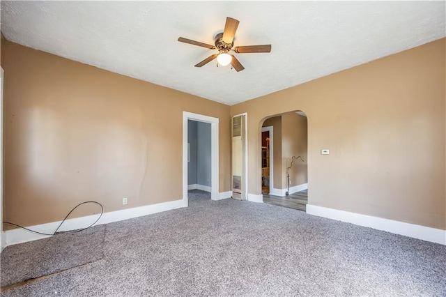 carpeted empty room with ceiling fan