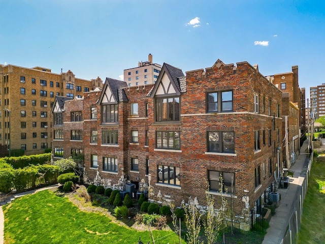 view of building exterior featuring central AC unit