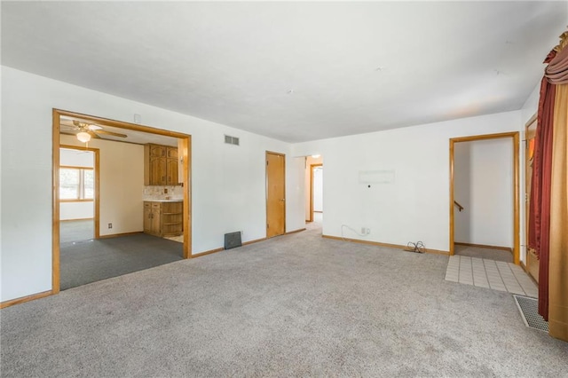 interior space with ensuite bath and carpet floors