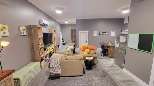 living room with ornamental molding, light hardwood / wood-style floors, and a wall mounted air conditioner