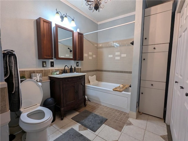 full bathroom featuring vanity, a textured ceiling, tiled shower / bath combo, tile patterned flooring, and toilet