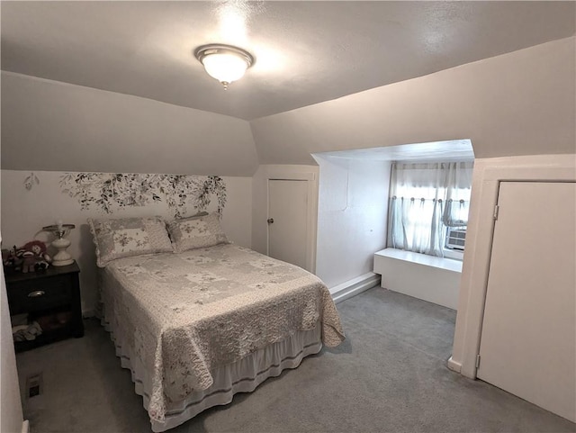 bedroom featuring lofted ceiling and carpet flooring