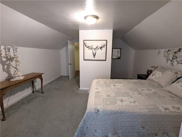 unfurnished bedroom with light carpet and lofted ceiling