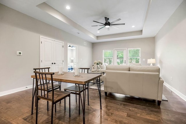 dining room featuring recessed lighting, ceiling fan, baseboards, and a raised ceiling