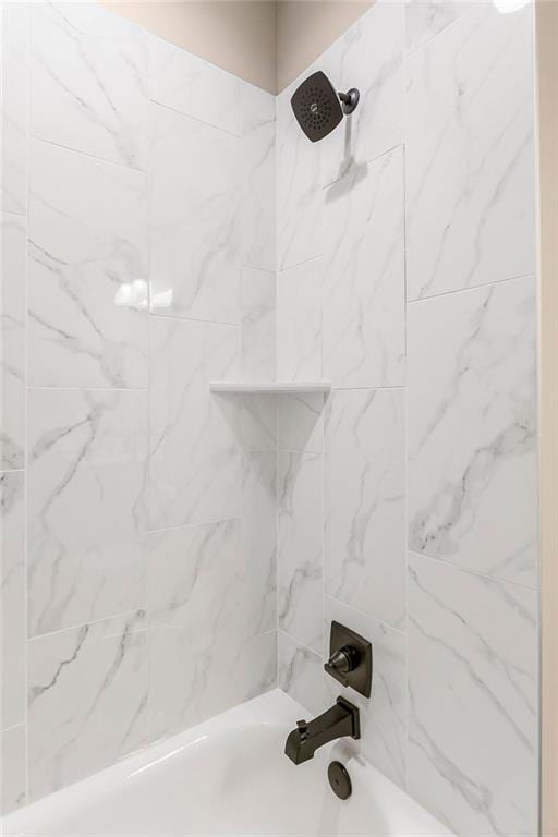 bathroom with shower / tub combination