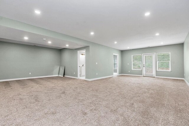 empty room featuring baseboards, carpet flooring, and recessed lighting