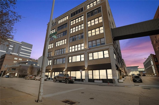 view of outdoor building at dusk