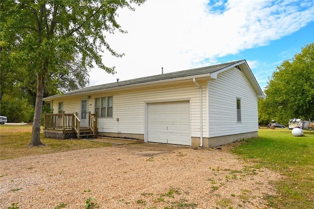 exterior space with a front yard and a garage