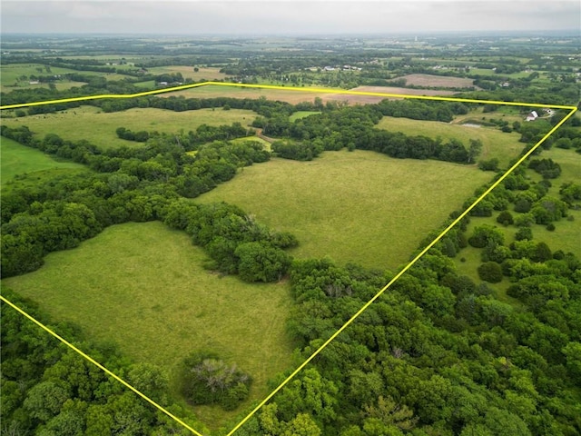 overview of rural landscape featuring property parcel outlined and a heavily wooded area