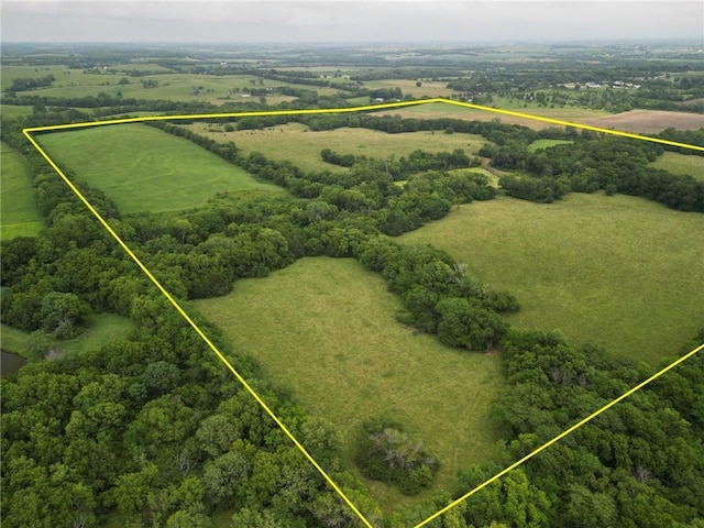 aerial view of sparsely populated area featuring property parcel outlined