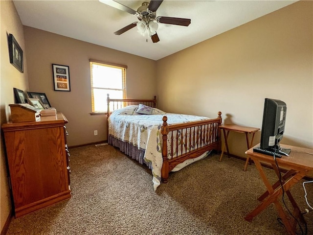 carpeted bedroom with baseboards and a ceiling fan
