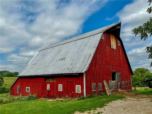 view of outbuilding with a lawn