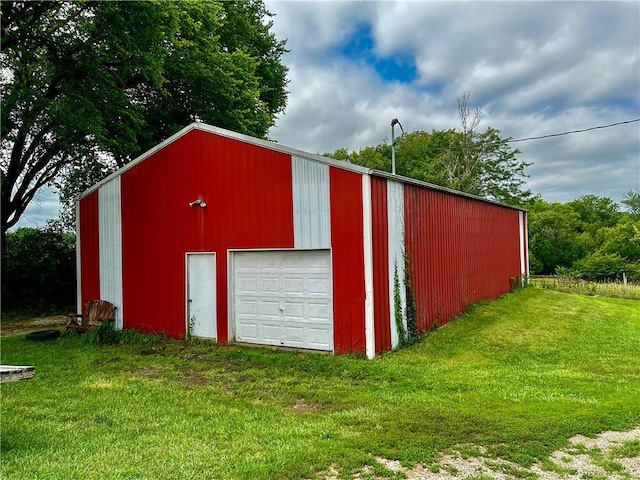 garage featuring a yard