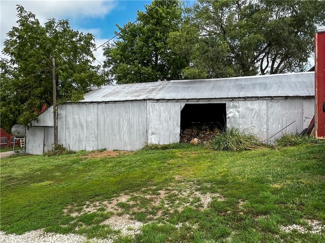 view of outdoor structure with a lawn