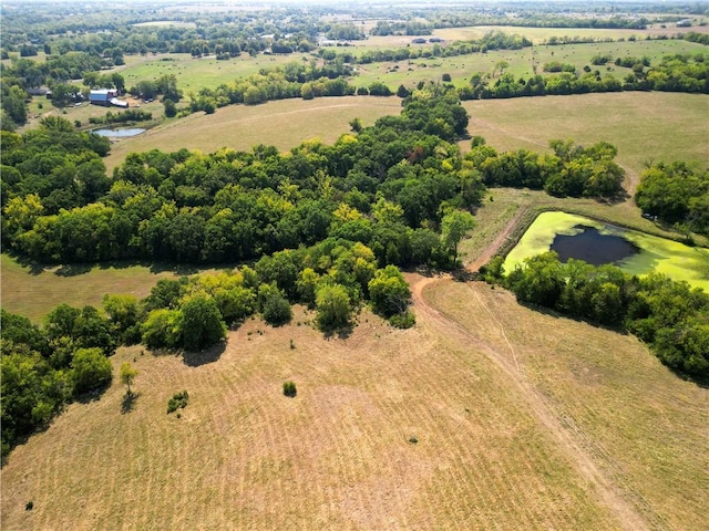 aerial view with a rural view and a water view