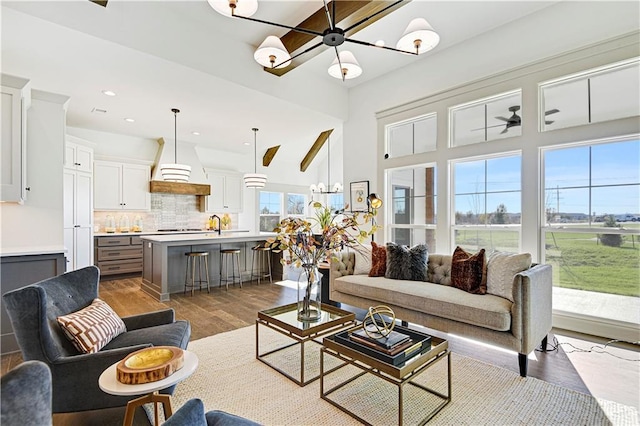 13485 W 174th Pl, Overland Park, KS 66221 - living room with a chandelier, wood finished floors, and recessed lighting