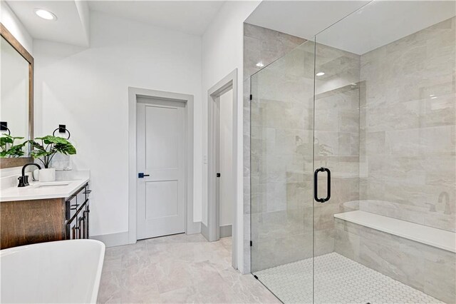 13485 W 174th Pl, Overland Park, KS 66221 - bathroom featuring a freestanding bath, vanity, a stall shower, baseboards, and recessed lighting
