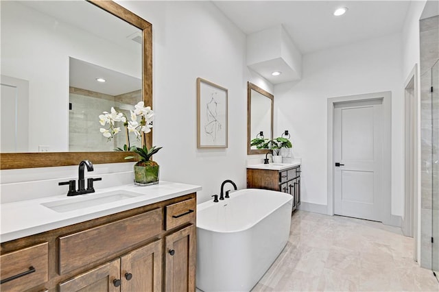 13485 W 174th Pl, Overland Park, KS 66221 - bathroom with a stall shower, two vanities, a freestanding tub, recessed lighting, and marble look tiles