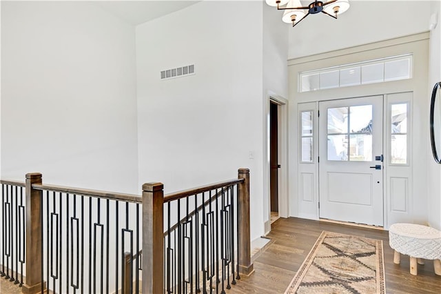 13485 W 174th Pl, Overland Park, KS 66221 - foyer with wood finished floors, a chandelier, and a high ceiling