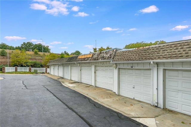 garage with fence