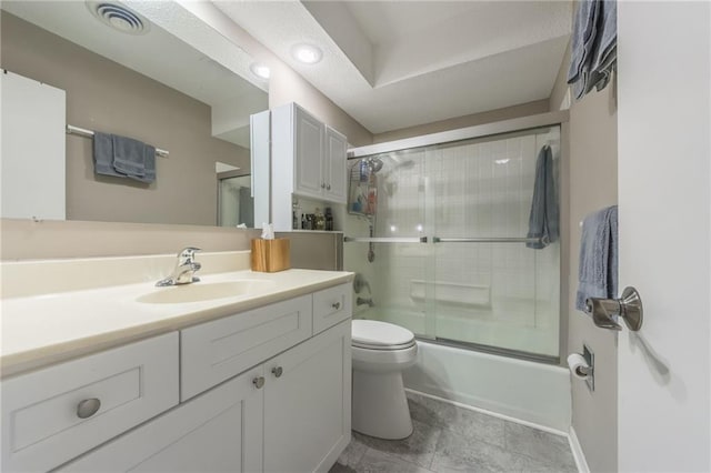 full bath featuring toilet, shower / bath combination with glass door, vanity, and visible vents