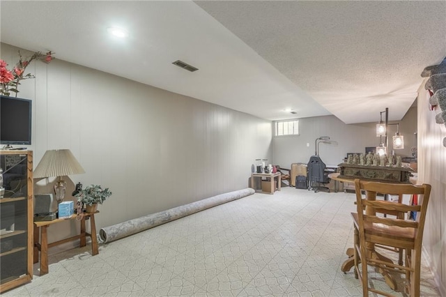 interior space with visible vents and a textured ceiling