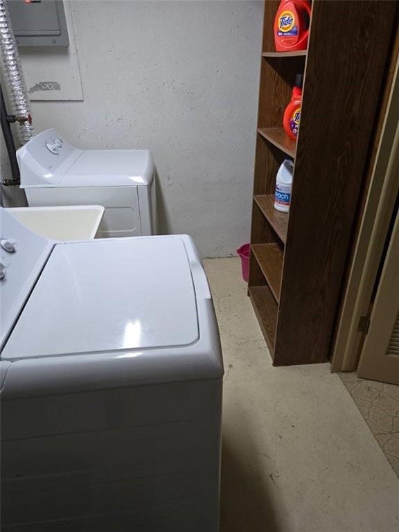 clothes washing area with laundry area and washer and dryer