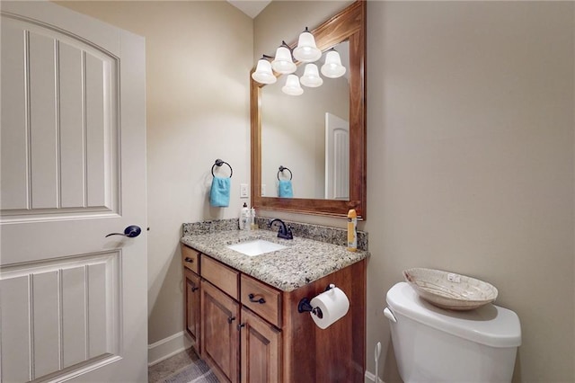 4602 NW Verona Dr, Riverside, MO 64150 - bathroom with vanity, toilet, and baseboards