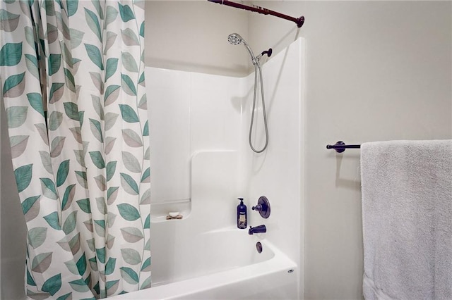 bathroom featuring shower / tub combo with curtain