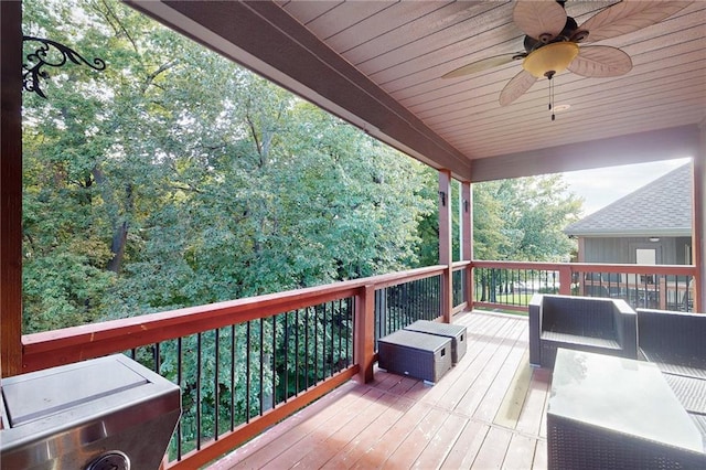 wooden deck featuring ceiling fan