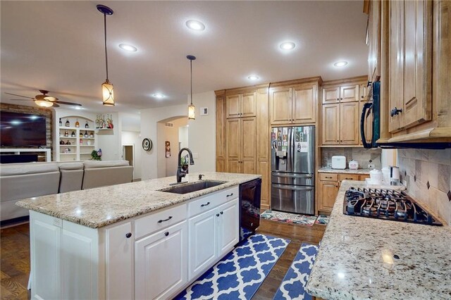 4602 NW Verona Dr, Riverside, MO 64150 - kitchen with black appliances, a sink, ceiling fan, a kitchen island with sink, and light stone countertops
