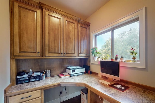 office area featuring built in desk