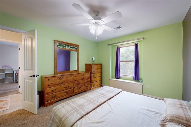 bedroom featuring ceiling fan and light carpet