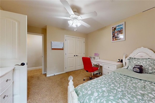 carpeted bedroom with ceiling fan and a closet