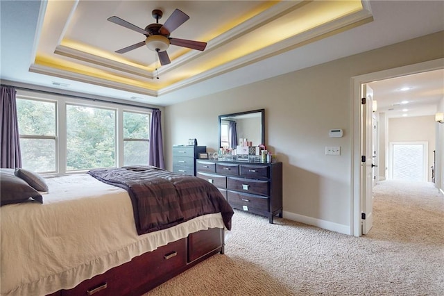 4602 NW Verona Dr, Riverside, MO 64150 - carpeted bedroom with a raised ceiling, baseboards, and a ceiling fan