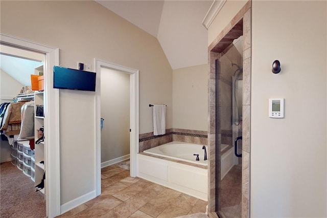 bathroom with lofted ceiling and plus walk in shower