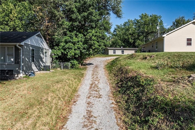 view of street featuring gravel driveway