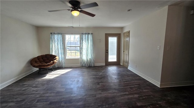 entrance foyer with dark wood-style floors, baseboards, and ceiling fan