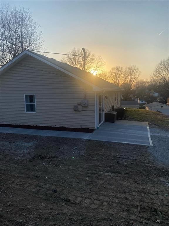 back of property with a patio