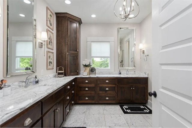 bathroom featuring vanity and an inviting chandelier