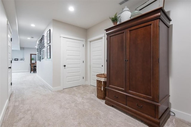 hallway with light carpet