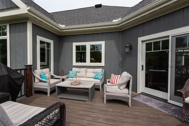 deck with area for grilling and an outdoor living space