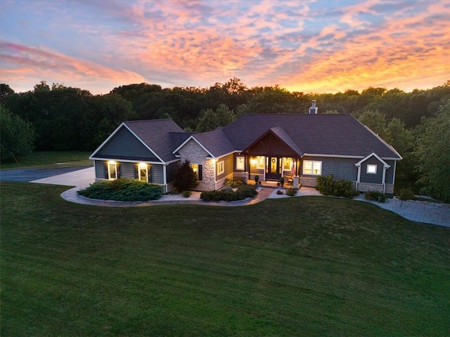 ranch-style house with a lawn