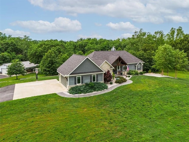 craftsman-style house featuring a front lawn and a garage